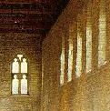 Light streams through tall stone arched windows...